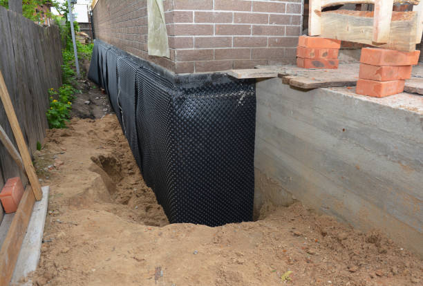 Happy homeowners after waterproofing job in Wrightstown